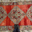 1970s red vintage Turkish medallion carpet with medallion design, hand-knotted weave and low pile.