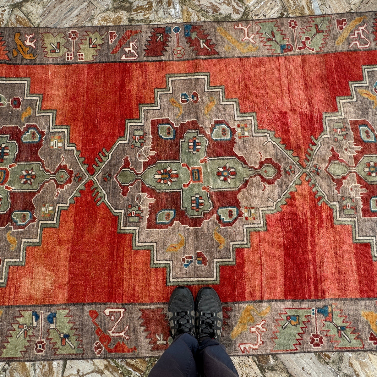 1970s red vintage Turkish medallion carpet with medallion design, hand-knotted weave and low pile.
