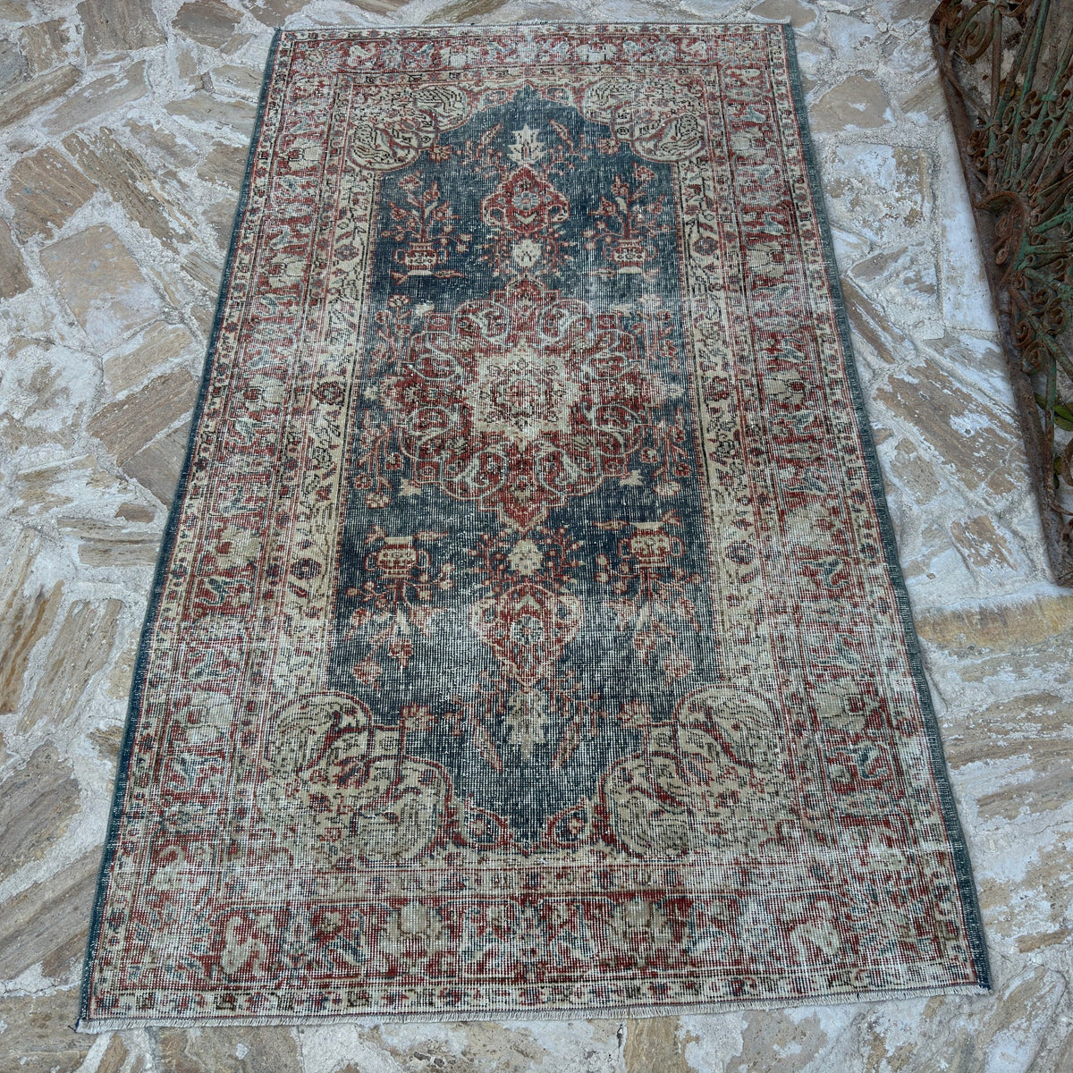 Blue 4' x 7' vintage Turkish medallion rug in wool and cotton, shown on the floor.