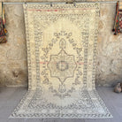 Beige 5' x 10' vintage medallion rug with neutral design, handmade in Turkey – Blanca.