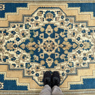 1970s blue vintage Turkish medallion rug with geometric design, hand-knotted weave and low pile.