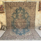 Blue 7' x 10' vintage medallion rug with medallion design, handmade in Turkey – Breaker.