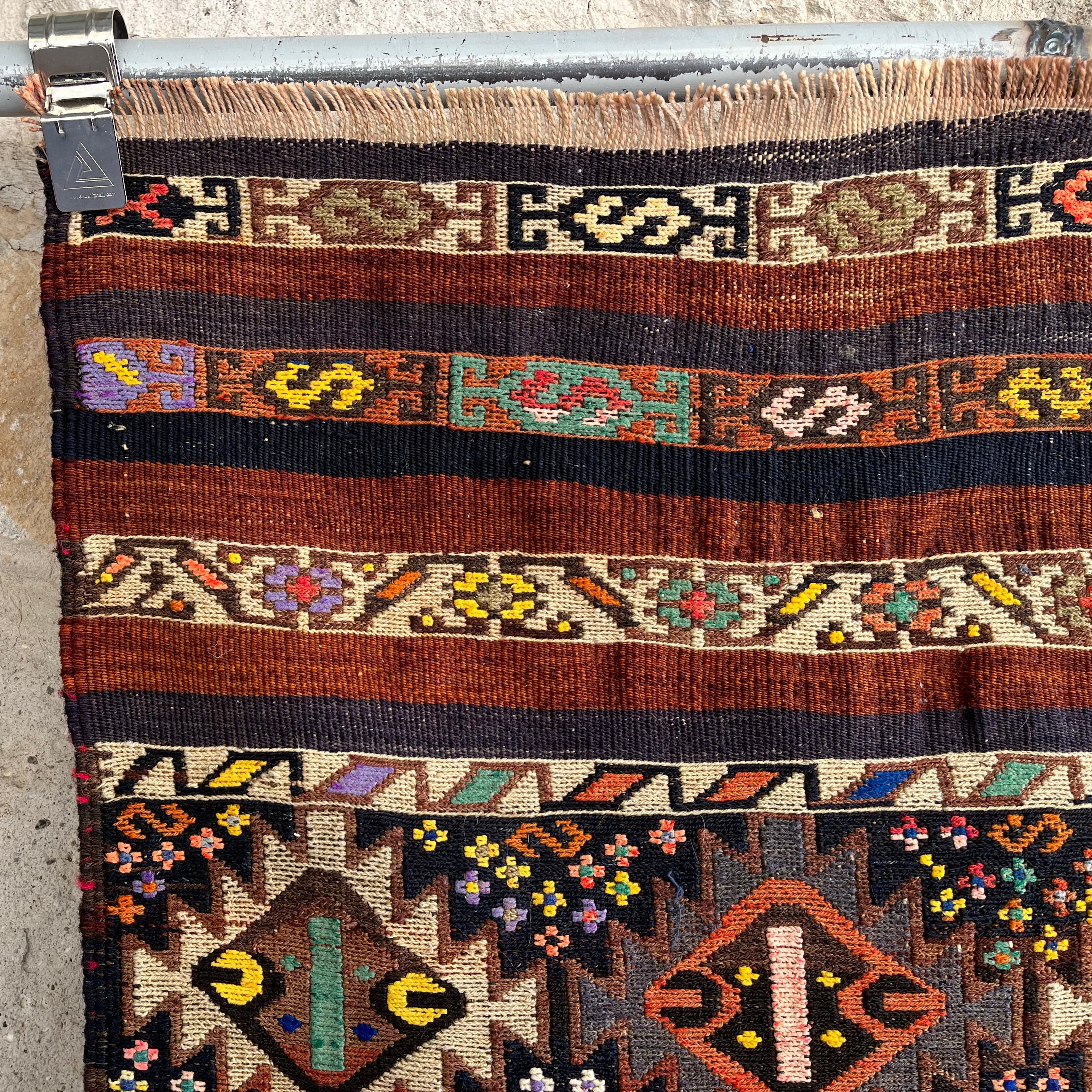 Brown 2' x 6' vintage mini kilim runner rug in wool and cotton, shown on the floor.