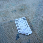 Beige 2' x 2' vintage Turkish mini rug from the 1970s with traditional design.
