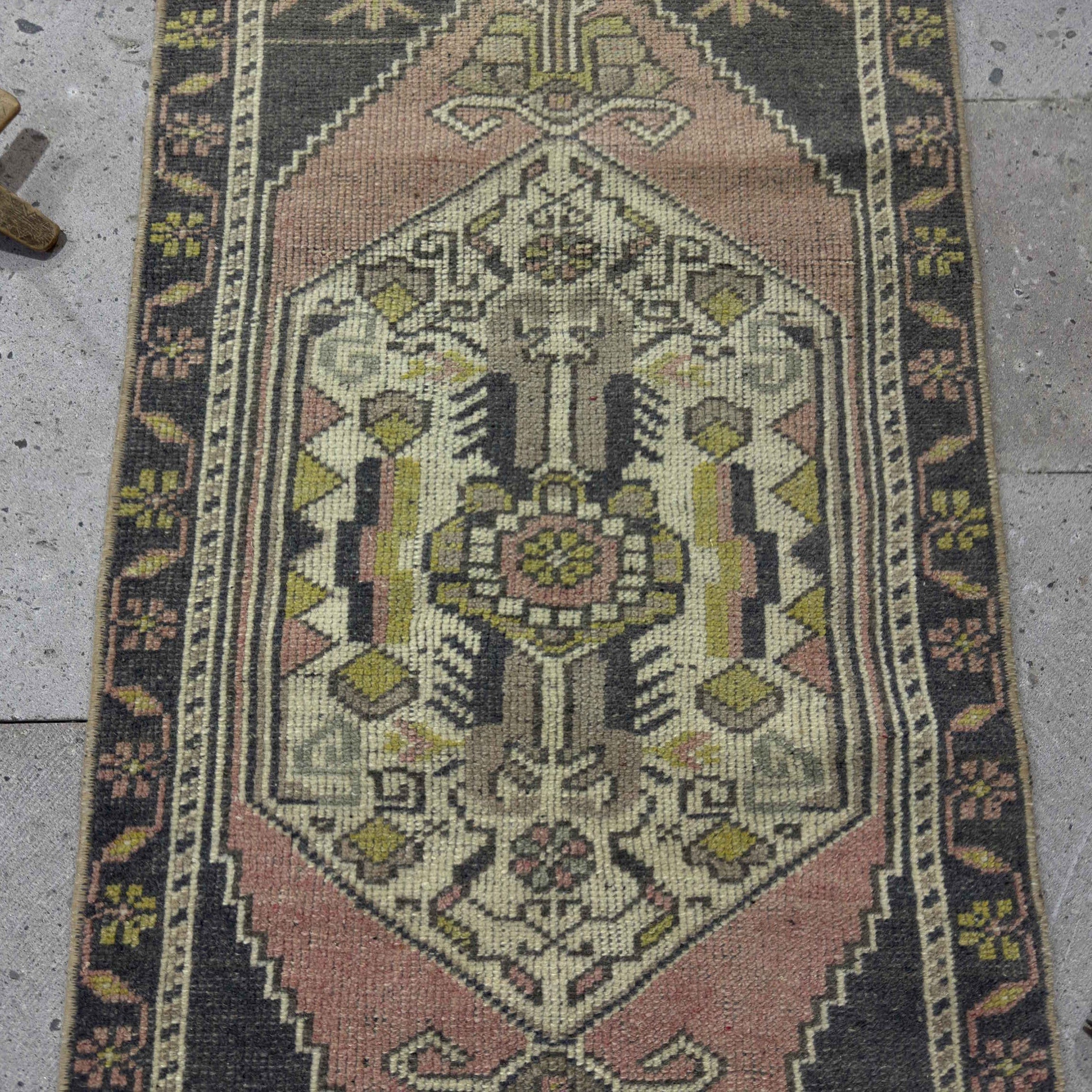 1970s pink vintage Turkish mini runner with traditional design, hand-knotted weave and low pile.
