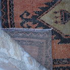 1970s orange vintage Turkish mini runner with traditional design, hand-knotted weave and low pile.