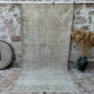 Beige 5' x 10' vintage muted rug with neutral design, handmade in Turkey – Peter.