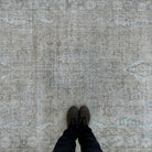 1970s beige vintage Turkish muted rug with neutral design, hand-knotted weave and low pile.