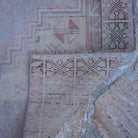 Pink 3' x 6' vintage Turkish neutral rug in wool, shown on the floor.