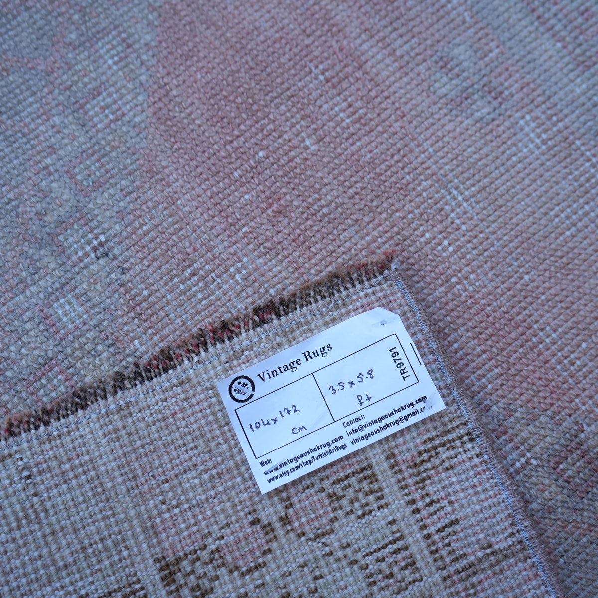 Additional view of the pink vintage Turkish neutral rug, hand-knotted in wool.