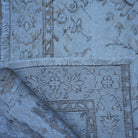 1970s beige vintage Turkish neutral rug with floral design, hand-knotted weave and low pile.