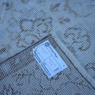 Beige 4' x 7' vintage Turkish neutral rug from the 1970s with floral design.