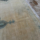 1970s beige vintage Turkish neutral wool rug with neutral design, hand-knotted weave and low pile.