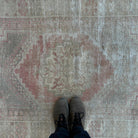 1970s pale red vintage Turkish oriental rug with neutral design, hand-knotted weave and low pile.