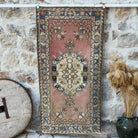 Pink 3' x 6' vintage oriental rug with geometric design, handmade in Turkey – Steel.