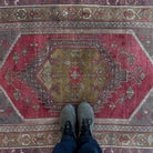 1970s red vintage Turkish oriental rug with traditional design, hand-knotted weave and low pile.