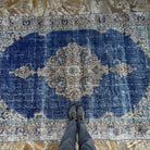 1970s blue vintage Turkish oriental rug with geometric design, hand-knotted weave and low pile.