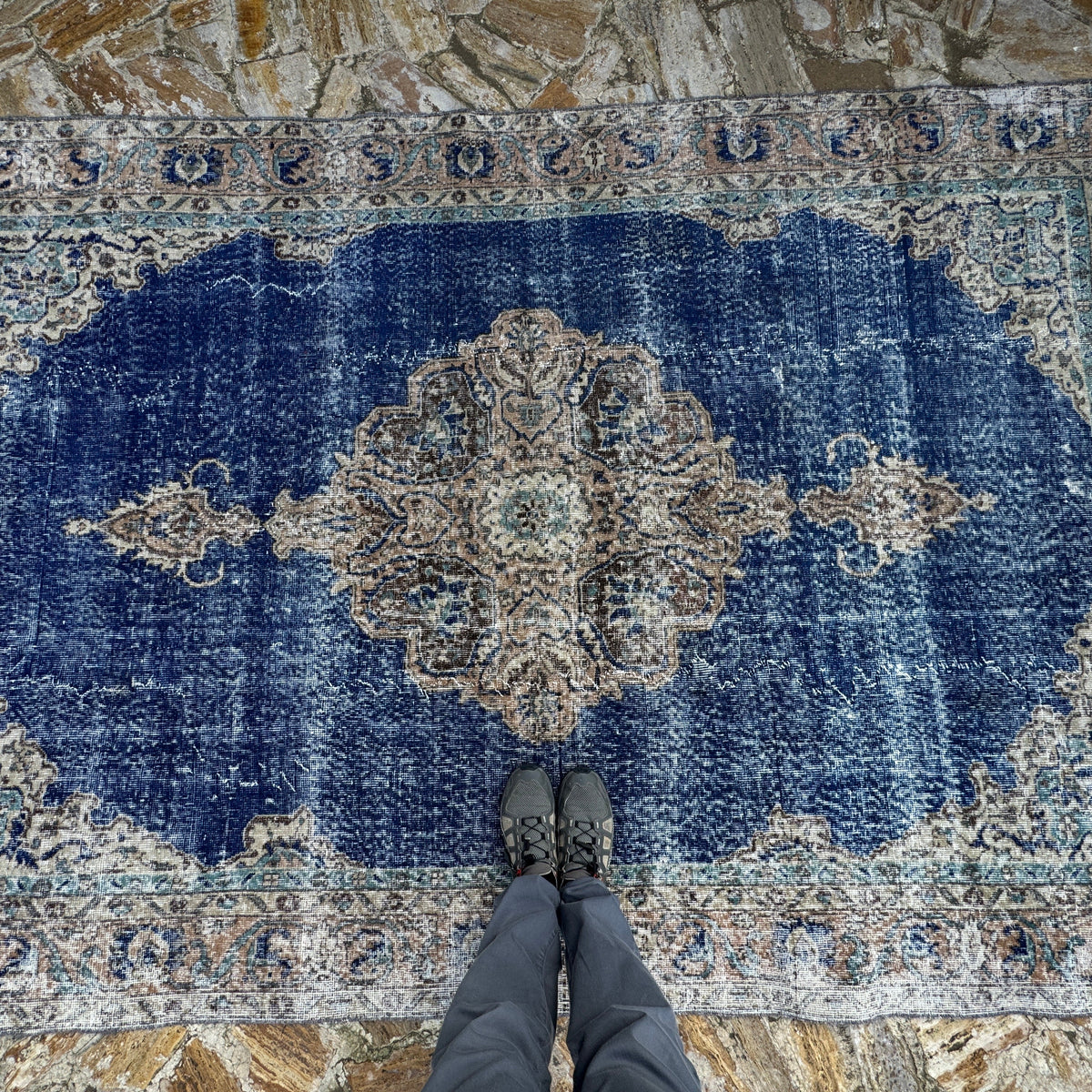 1970s blue vintage Turkish oriental rug with geometric design, hand-knotted weave and low pile.
