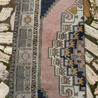 1970s pink vintage Turkish oriental runner rug with traditional design, hand-knotted weave and low pile.