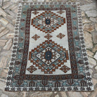 Brown 4' x 5' vintage Turkish oushak rug in wool and cotton, shown on the floor.