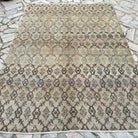Beige 6' x 9' vintage Turkish oushak rug in wool and cotton, shown on the floor.