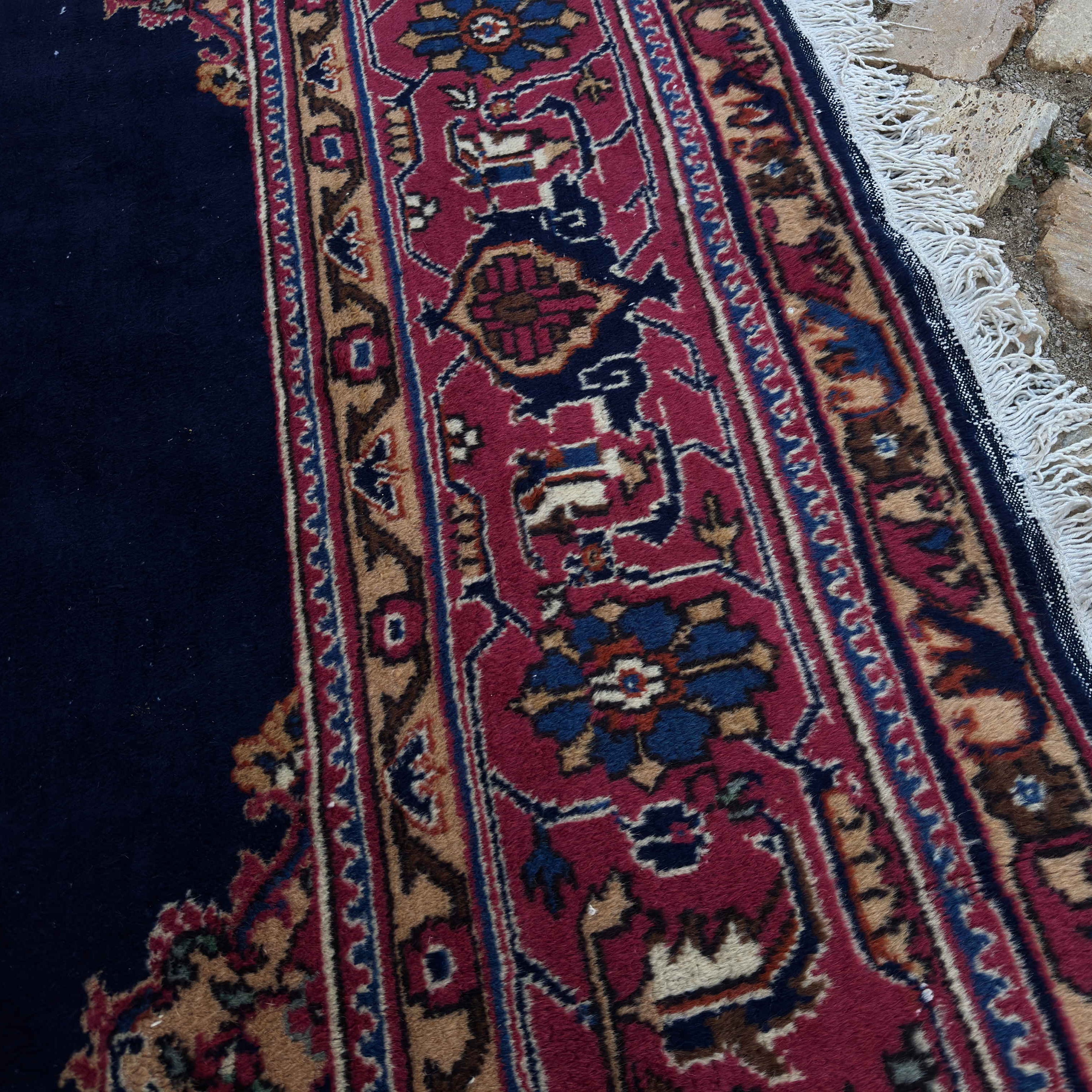 Close-up of the blue vintage Turkish oushak rug showing medallion details, hand-knotted weave, wool and cotton and low pile.