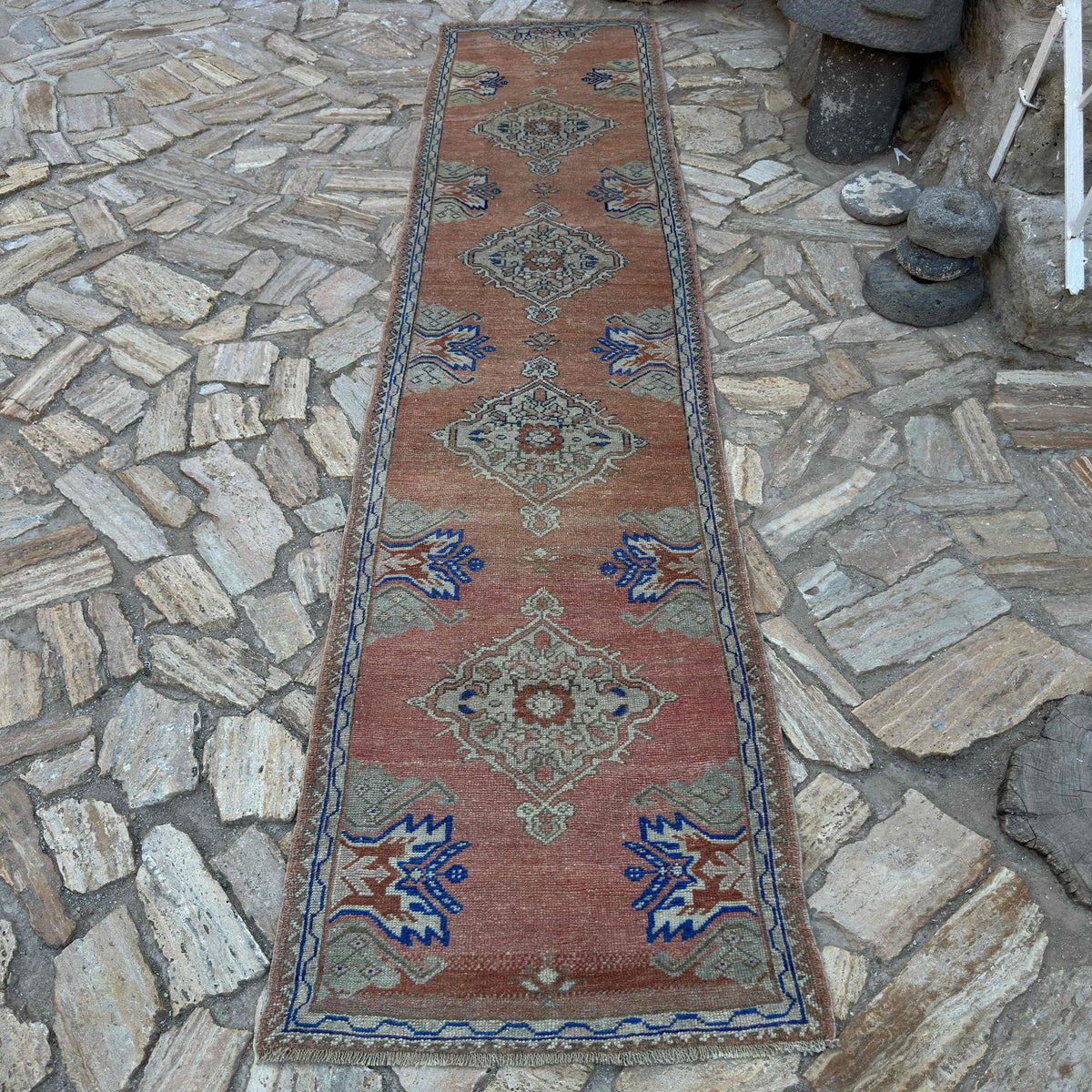 Pale Red 3' x 12' vintage Turkish oushak runner rug in wool and cotton, shown on the floor.