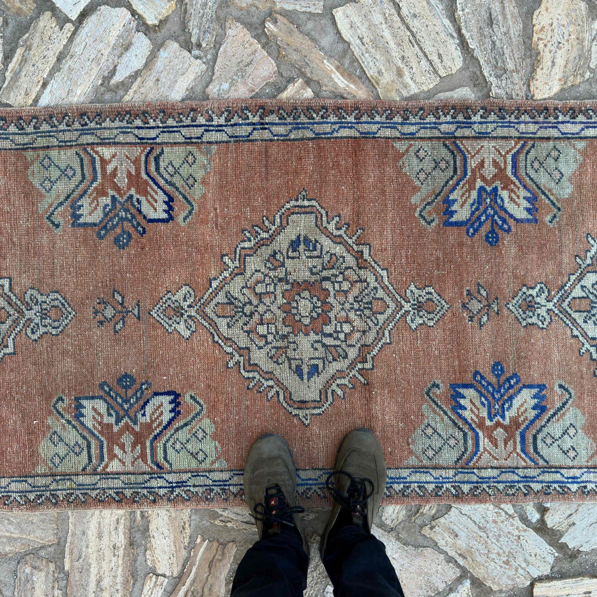 1970s pale red vintage Turkish oushak runner rug with oushak design, hand-knotted weave and low pile.