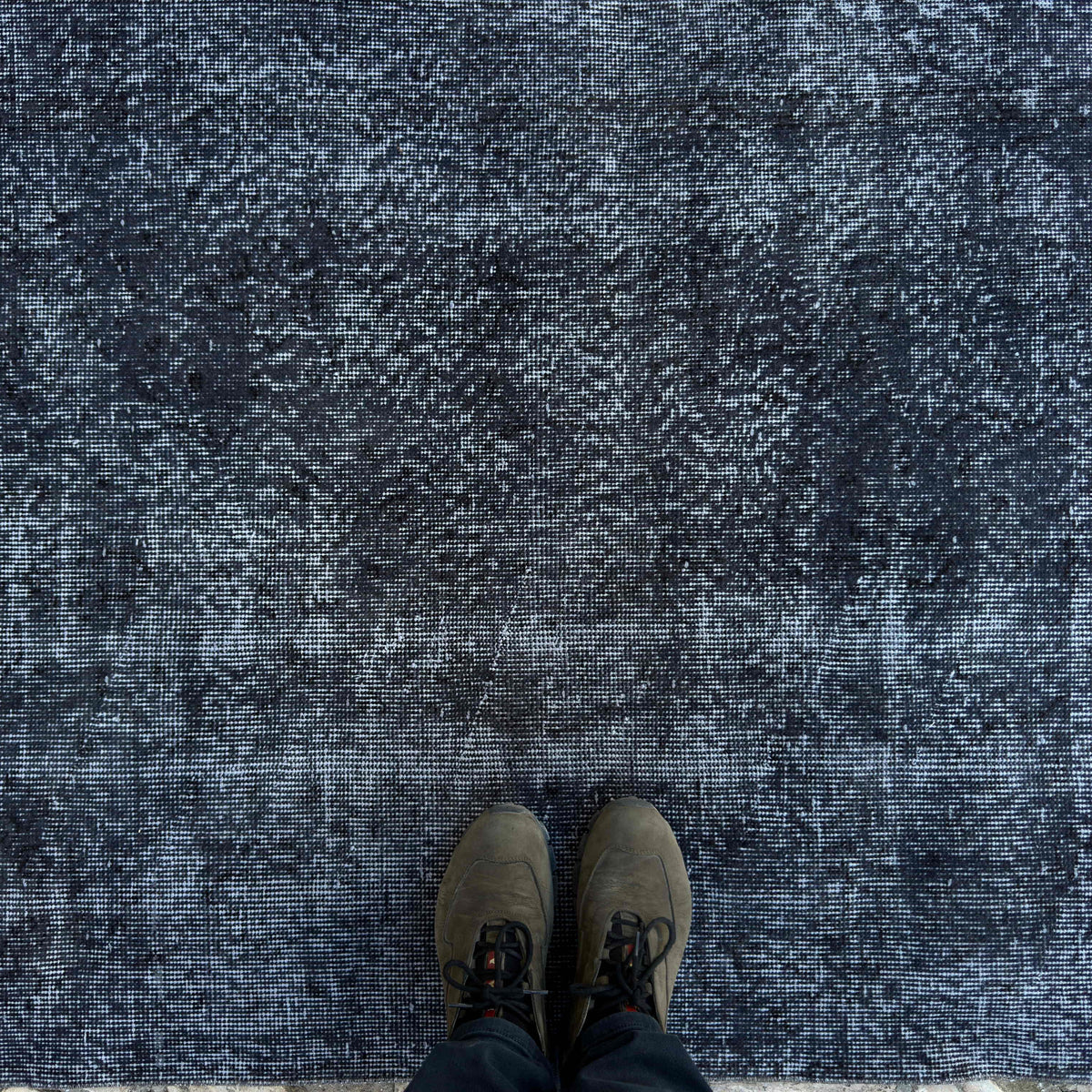 1970s black vintage Turkish overdyed rug with overdyed design, hand-knotted weave and low pile.