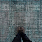 1970s blue vintage Turkish overdyed rug with overdyed design, hand-knotted weave and low pile.