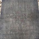 1970s gray vintage Turkish overdyed rug with overdyed design, hand-knotted weave and low pile.