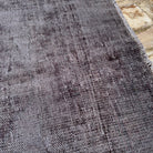 Additional view of the gray vintage Turkish overdyed rug, hand-knotted in wool and cotton.
