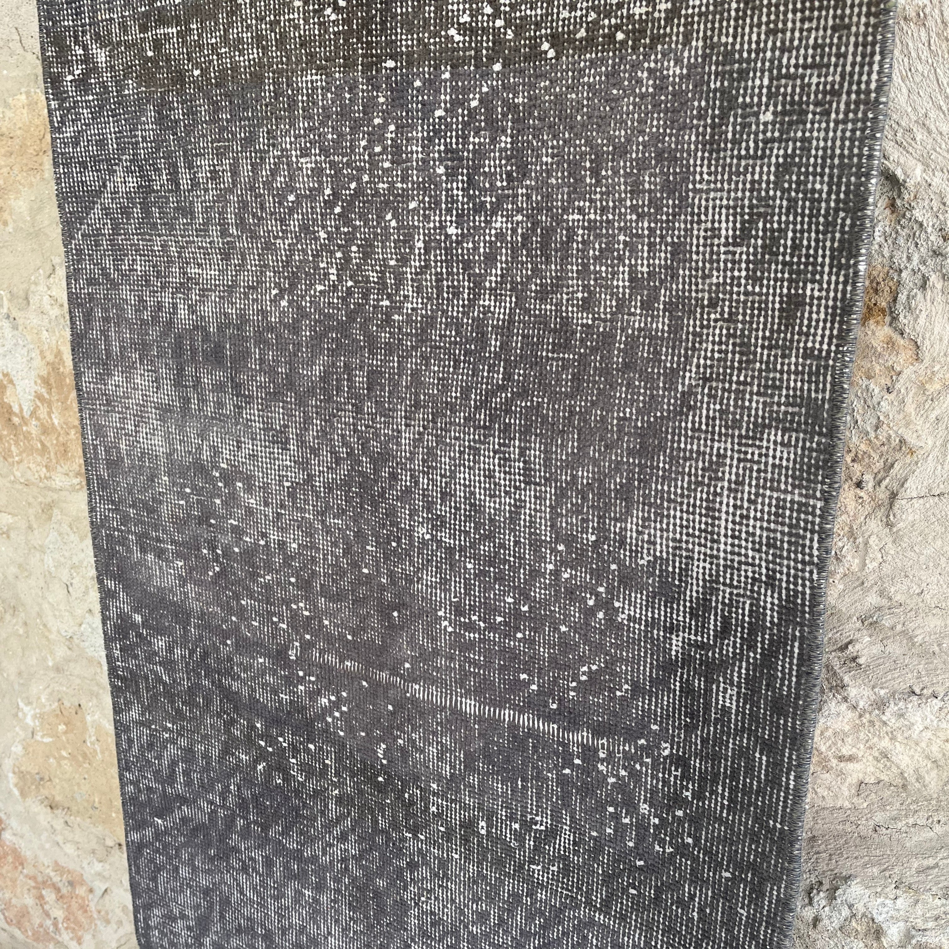 1970s gray vintage Turkish overdyed runner rug with overdyed design, hand-knotted weave and low pile.