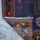 1970s purple vintage Turkish persian rug with geometric design, hand-knotted weave and low pile.