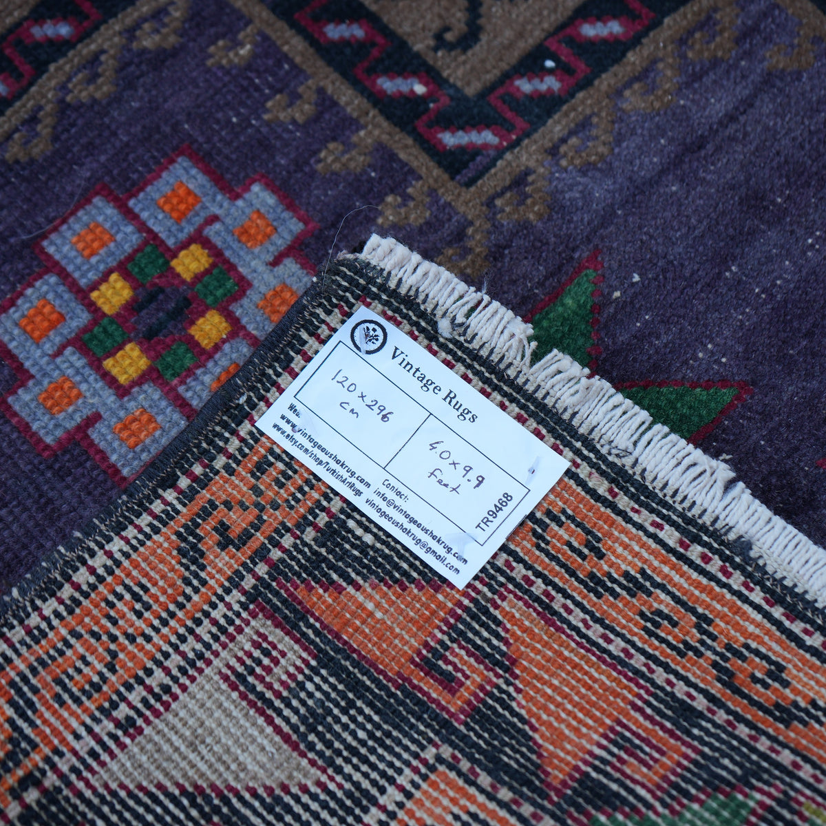 Purple 4' x 10' vintage Turkish persian rug from the 1970s with geometric design.
