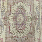 1970s pink vintage persian rug with medallion design, hand-knotted weave and low pile.