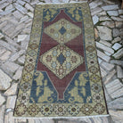 Red 4' x 7' vintage Turkish persian rug in wool and cotton, shown on the floor.