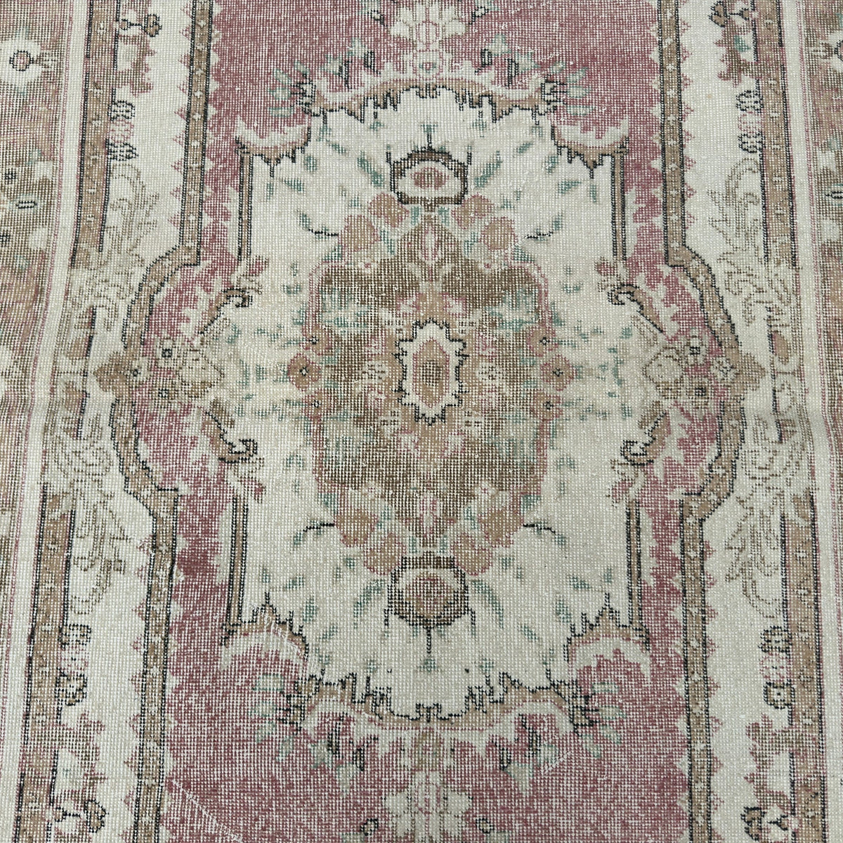 1970s pink vintage Turkish persian rug with medallion design, hand-knotted weave and low pile.