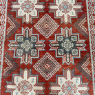1970s red vintage persian rug with traditional design, hand-knotted weave and low pile.