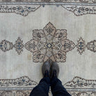 1970s beige vintage Turkish persian rug with neutral design, hand-knotted weave and low pile.