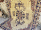 Blue 6' x 10' vintage Turkish persian rug in wool and cotton, shown on the floor.