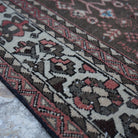 Red 6' x 7' vintage Turkish persian rug in wool and cotton, shown on the floor.