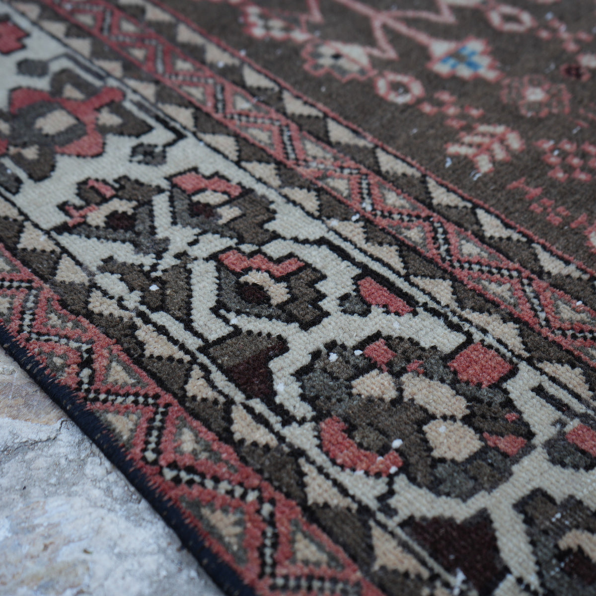 Red 6' x 7' vintage Turkish persian rug in wool and cotton, shown on the floor.