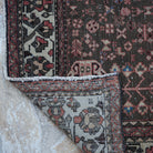 1970s red vintage Turkish persian rug with geometric design, hand-knotted weave and low pile.