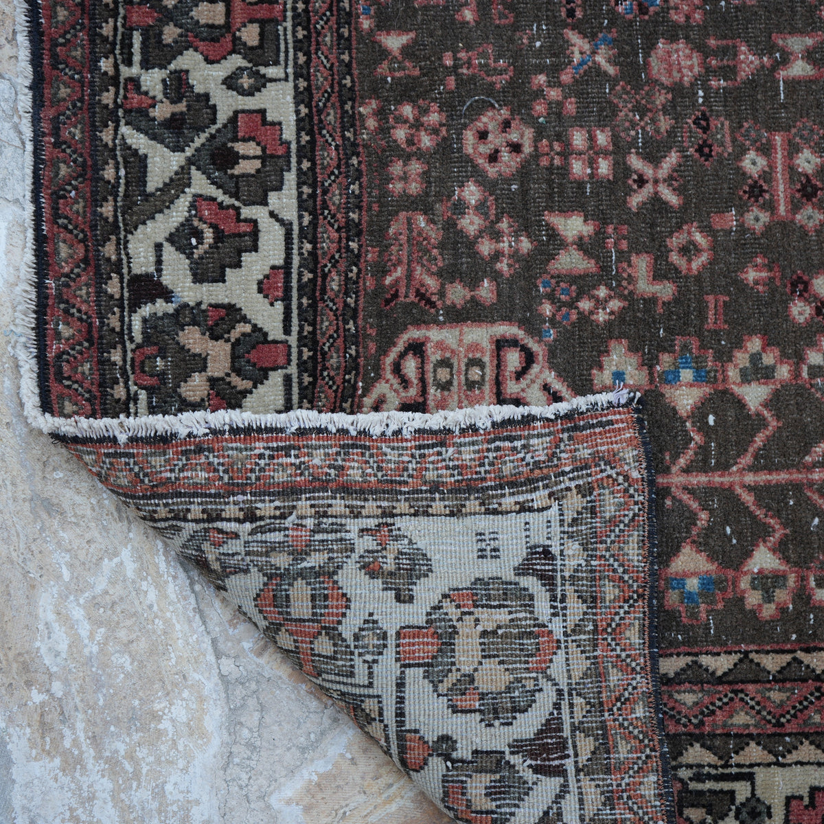 1970s red vintage Turkish persian rug with geometric design, hand-knotted weave and low pile.