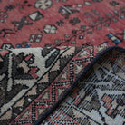 Additional view of the red vintage Turkish persian rug, hand-knotted in wool and cotton.
