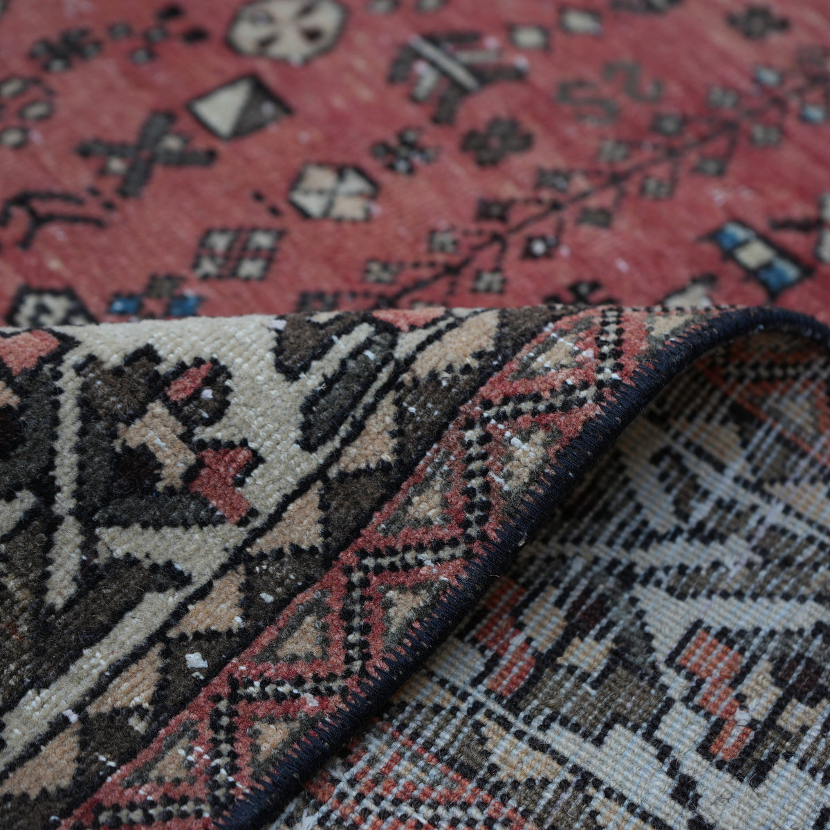 Additional view of the red vintage Turkish persian rug, hand-knotted in wool and cotton.