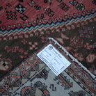 Red 6' x 7' vintage Turkish persian rug from the 1970s with geometric design.