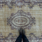 1970s yellow vintage Turkish persian rug with medallion design, hand-knotted weave and low pile.