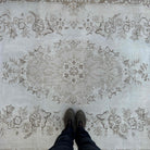 1970s beige vintage Turkish persian rug with neutral design, hand-knotted weave and low pile.